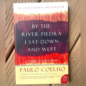 Lightly used “By The River Piedra I Sat Down and Wept” book by Paulo Coelho